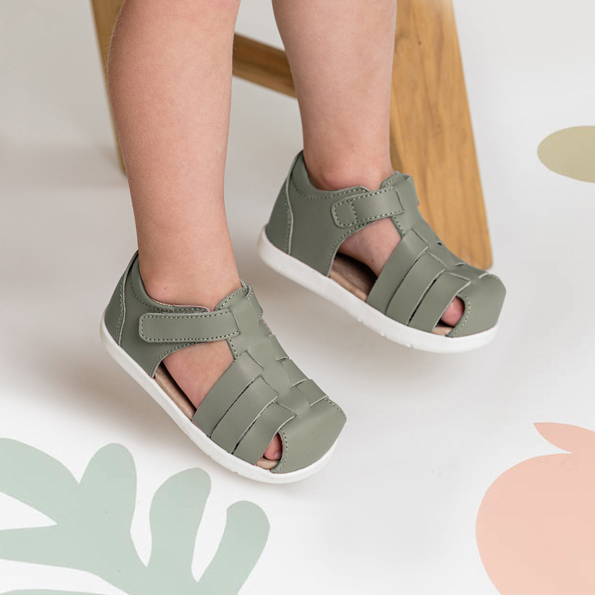 Child wearing pair of Billie sandal in colour Olive