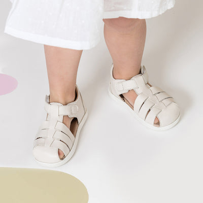 Child wearing Billie sandals in colour Stone