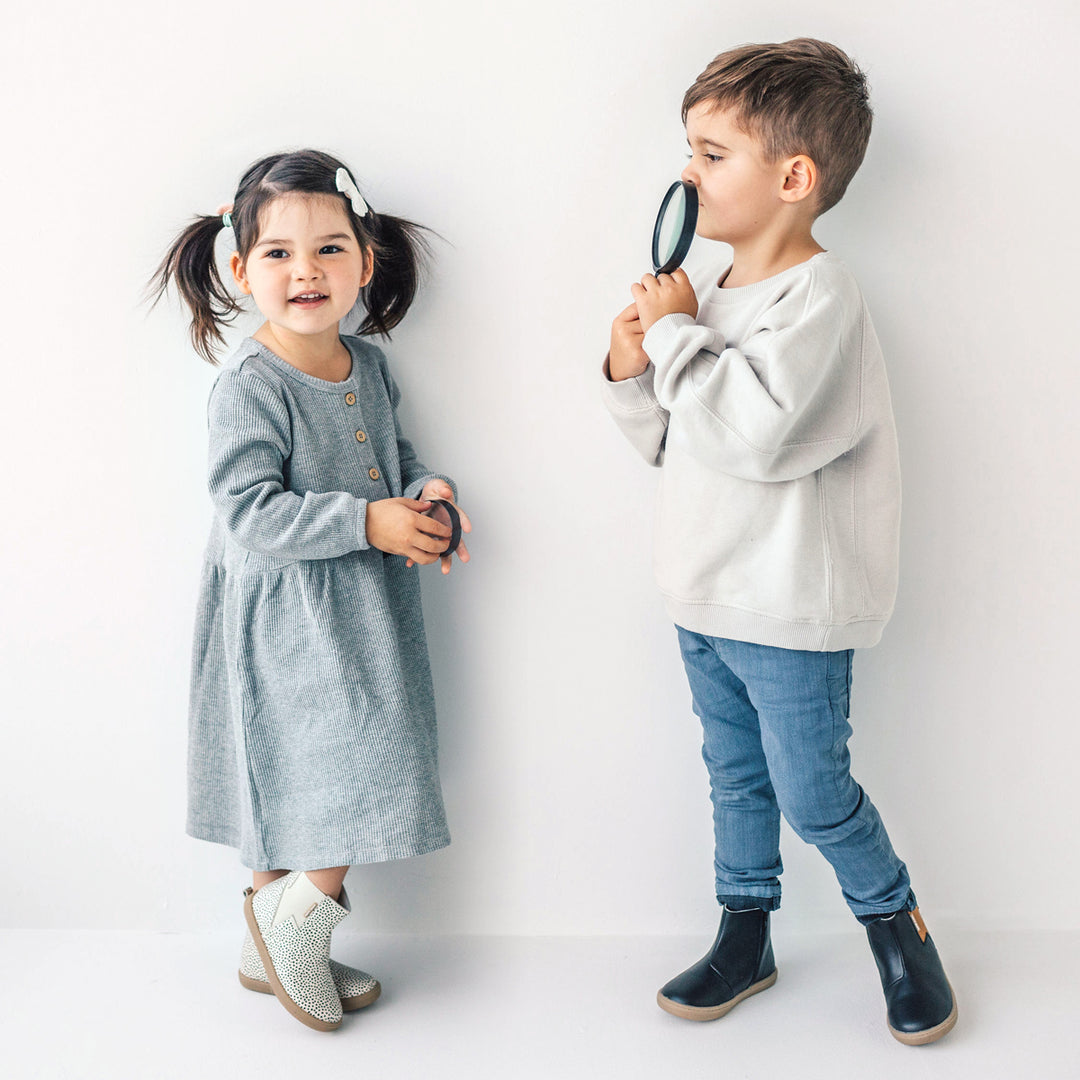 Two children playing wearing Electric boot design