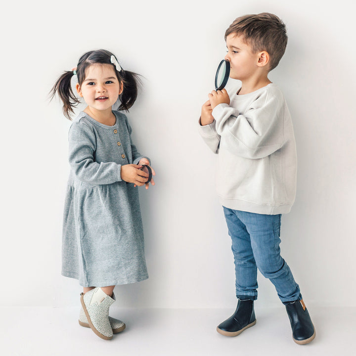 Two kids playing wearing electric boot design