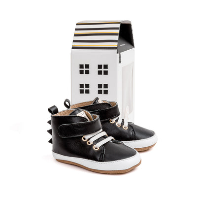 black dragon hi-top boot box Pretty Brave baby shoes next to cardboard house