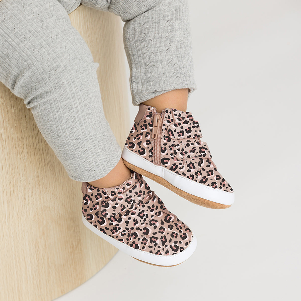 Toddler wearing Hi Top shoe in leopard print