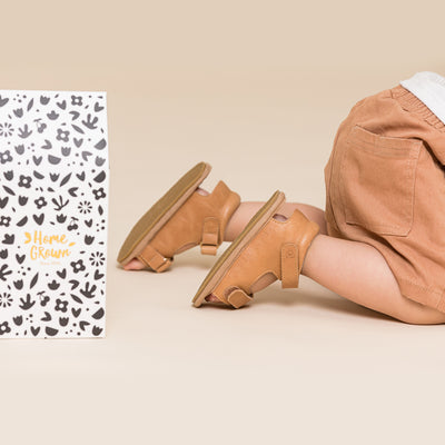 Baby crawling wearing baby sandals in sierra colour