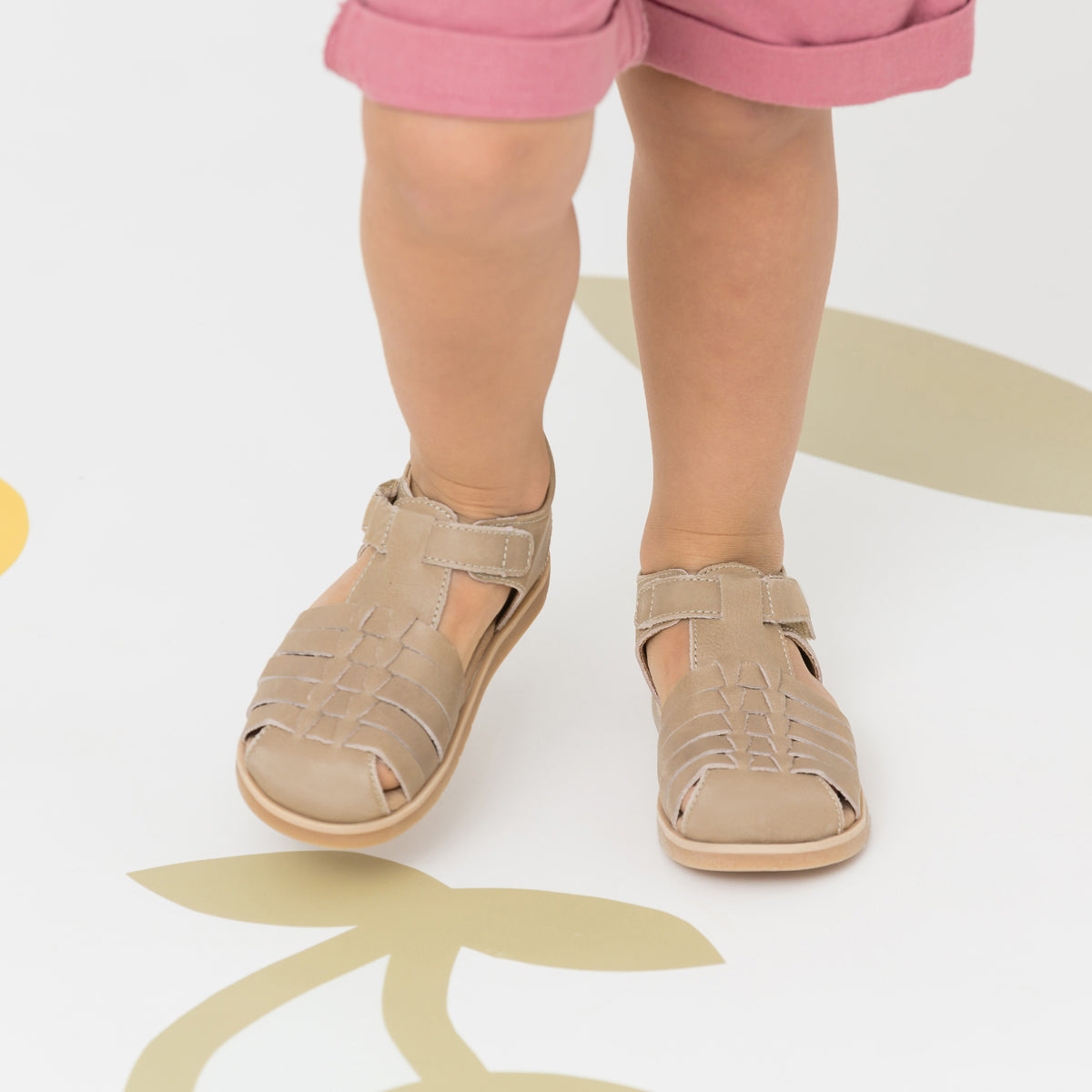 Child wearing Frankie sandals in colour Tan